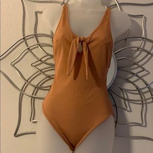 Brown body suit